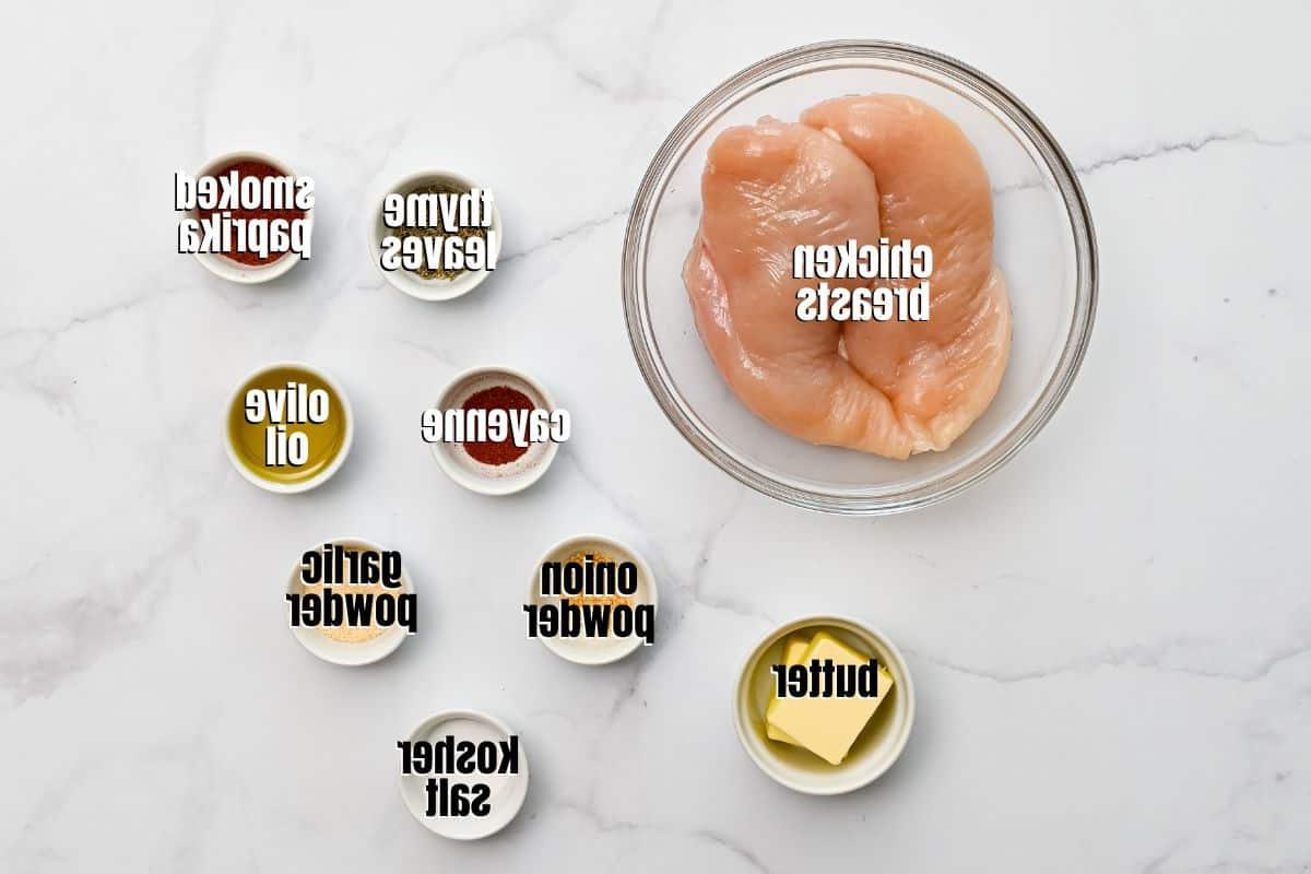 Ingredients for Blackened Chicken Recipe labeled on counter.