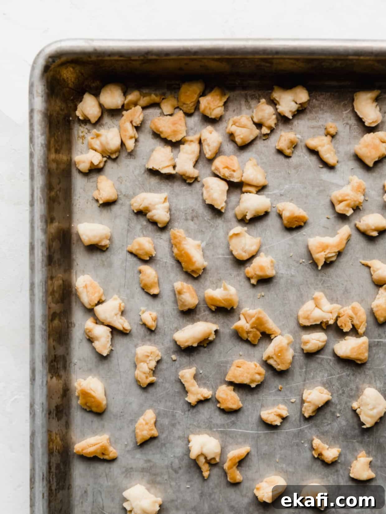 Creamy Chicken Pot Pie Noodles 4 A baking sheet with golden pie crust crumbles on it.