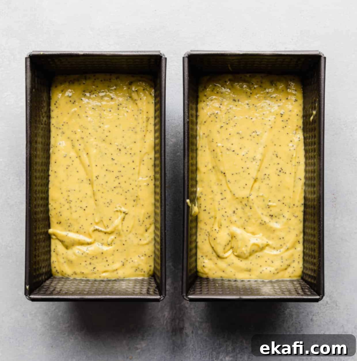 Cake Mix Lemon Poppy Seed Loaf 6 Two loaf pans full of lemon poppy seed bread batter.