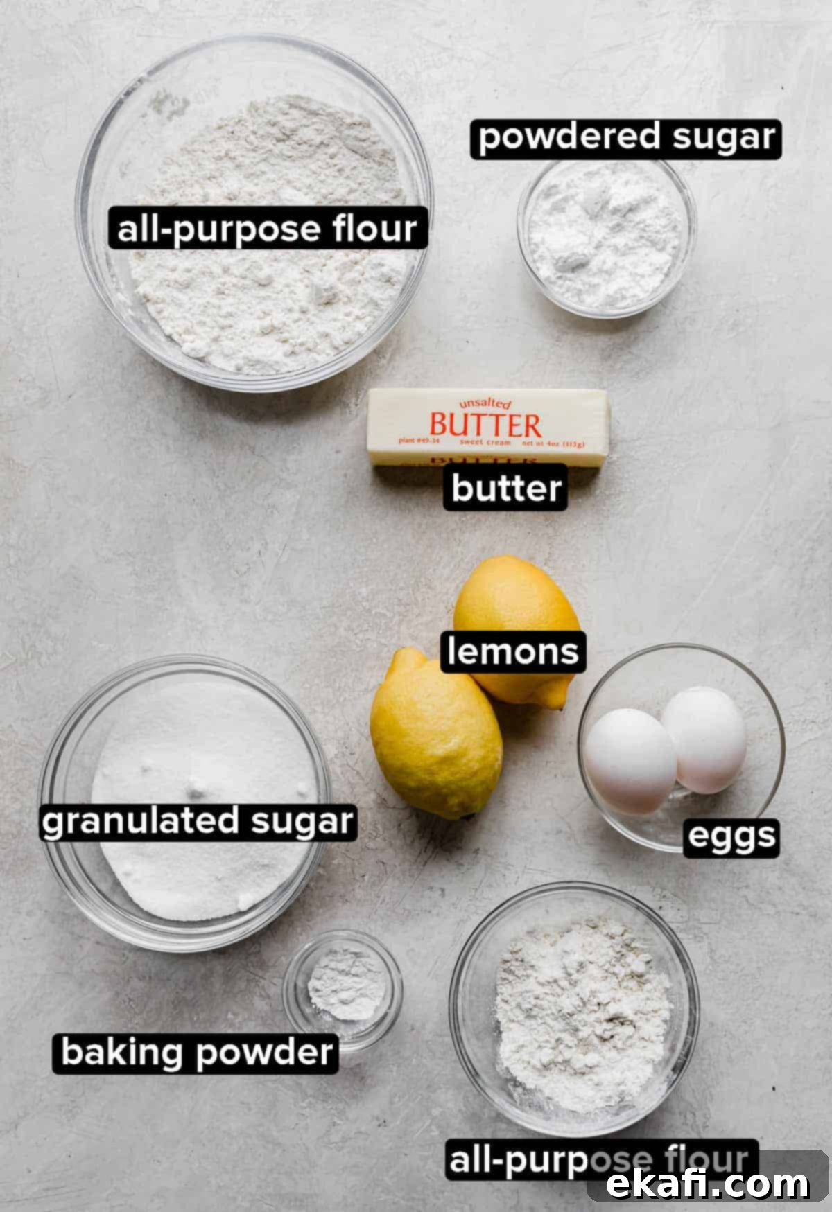Irresistible Old Fashioned Lemon Squares 3 Various fresh lemon bar ingredients laid out on a light gray background.