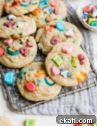 Magic Lucky Charms Cookies 14 Lucky Charms Cookies on a wire rack on a gray napkin.