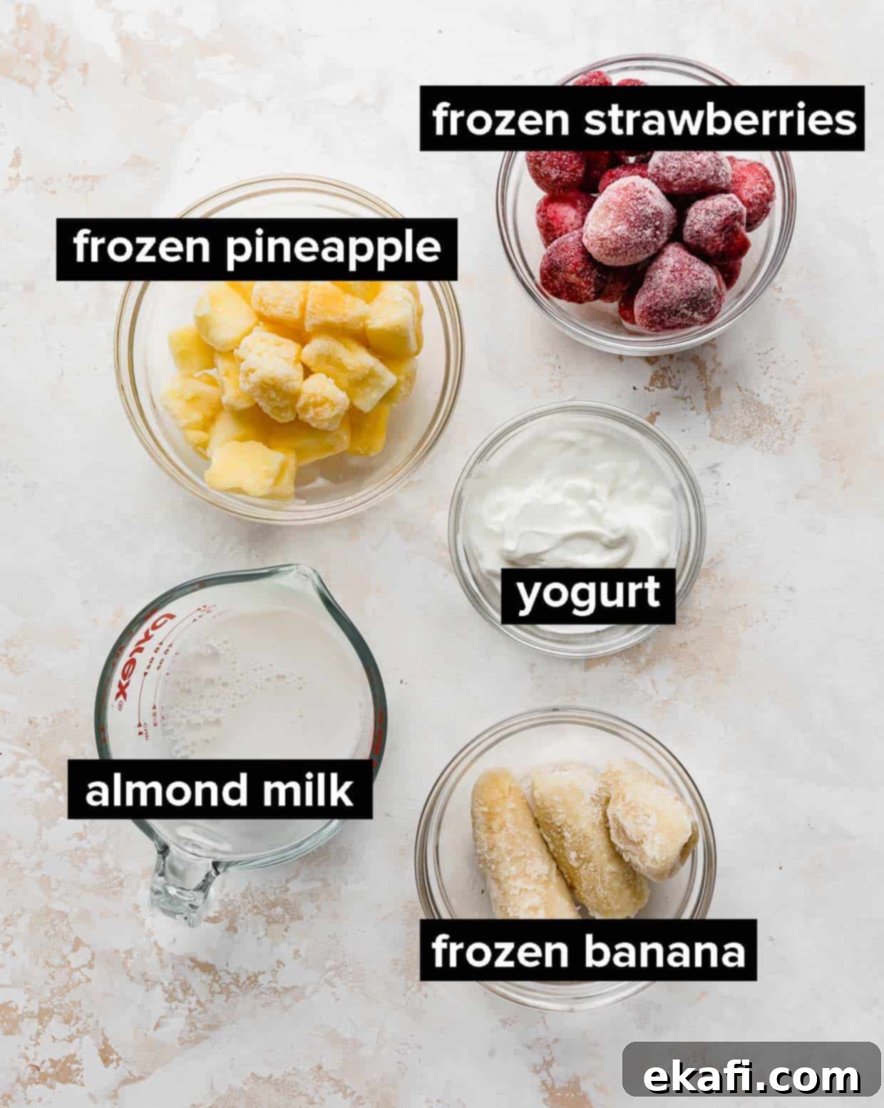 Tropical Strawberry Pineapple Smoothie 4 Ingredients used to make strawberry pineapple smoothie; milk, banana, strawberries, yogurt, and pineapple.