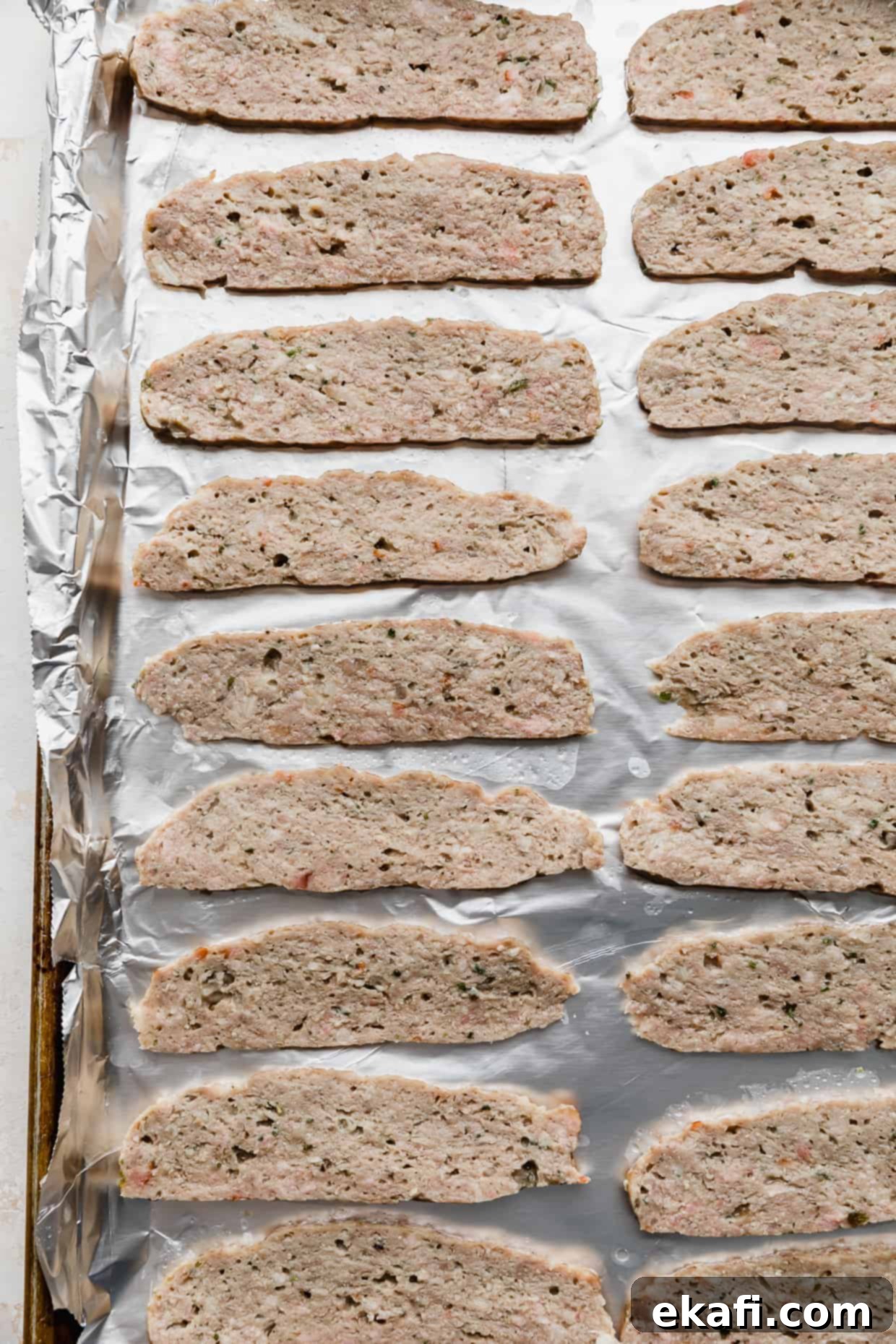 Mediterranean Lamb Gyros 8 Thinly sliced pieces of lamb meat on a foil lined baking sheet, perfectly broiled with crispy edges.