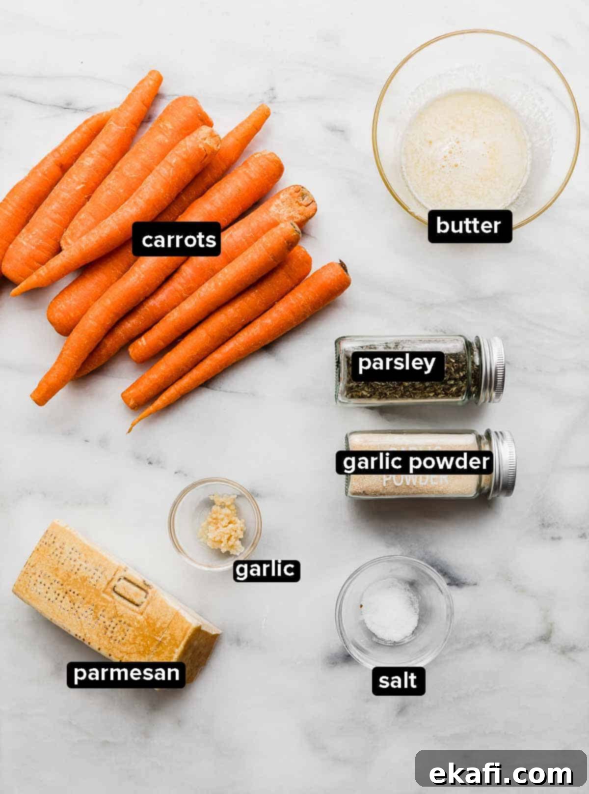 Golden Parmesan Roasted Carrots 3 All the fresh ingredients laid out for making Garlic Butter Roasted Carrots: vibrant carrots, golden butter, fresh garlic, salt, parsley, and parmesan cheese.