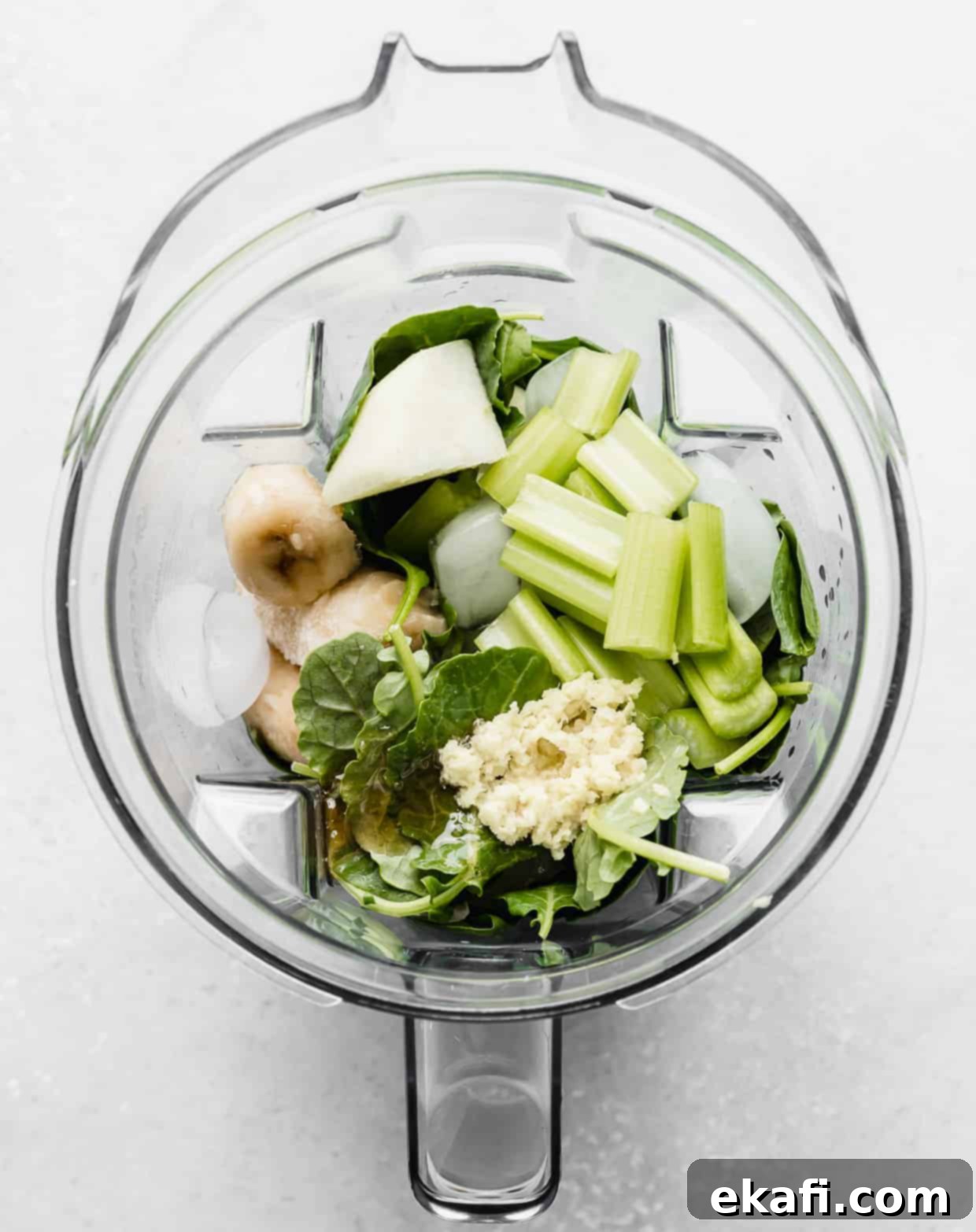 Green Celery Smoothie 4 Ingredients used to make a celery smoothie in a blender.