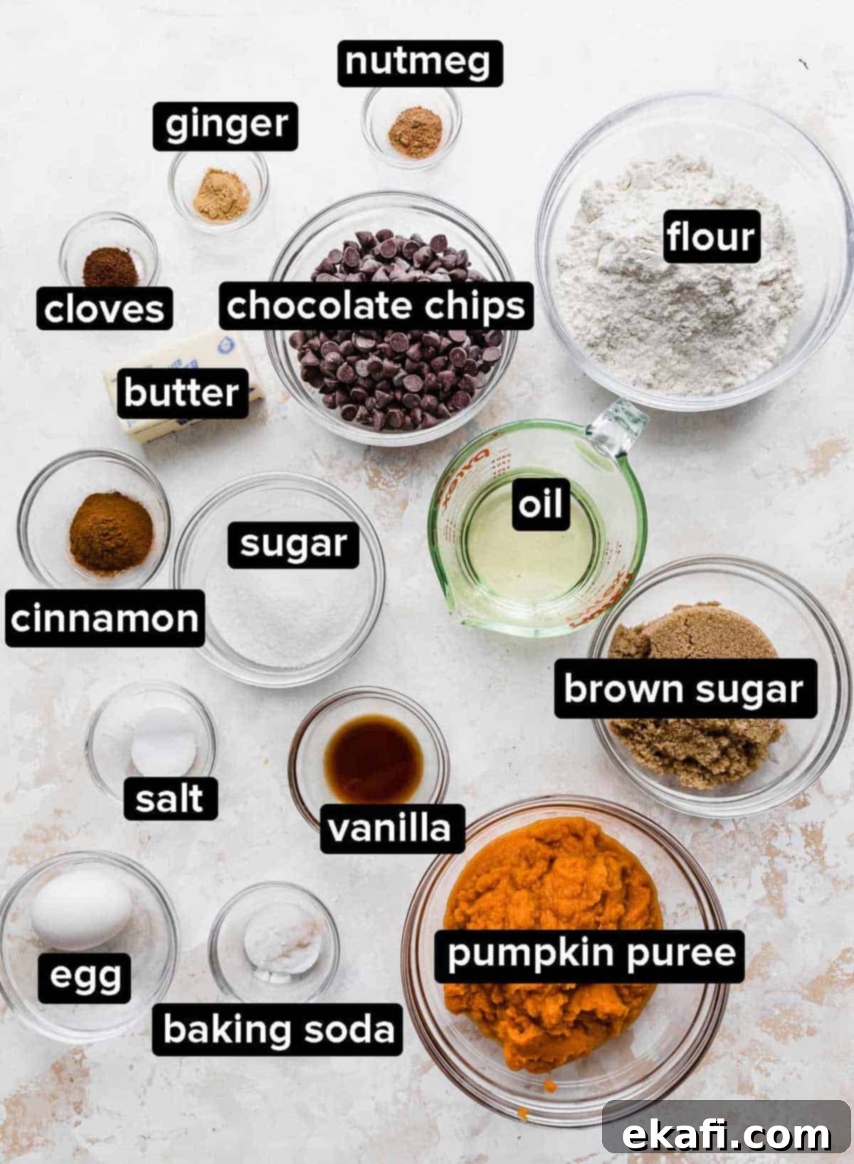 Cozy Pumpkin Chocolate Chip Coffee Cake 3 Pumpkin Chocolate Chip Coffee Cake ingredients on a cream textured background.
