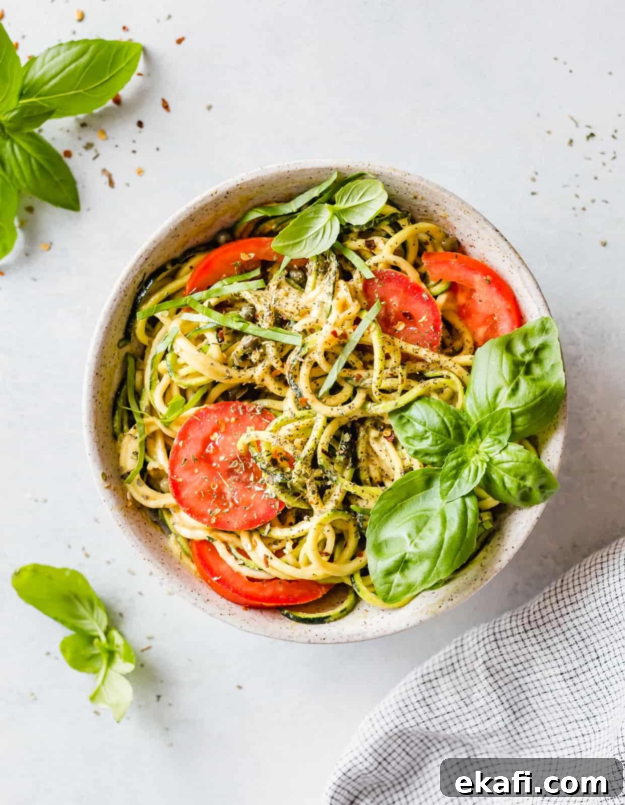Fluted Zucchetti 2 5-Minute Cheesy Zucchetti Bowl: a delicious and healthy zucchini noodles recipe that is gluten-free, low carb, and packed with veggies.