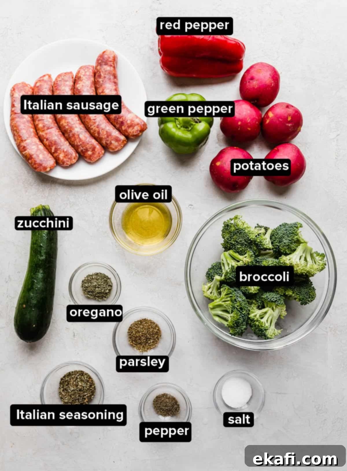 One Pan Roasted Italian Sausage and Vibrant Vegetables 3 Sheet Pan Italian Sausage and Veggies ingredients on a gray background.