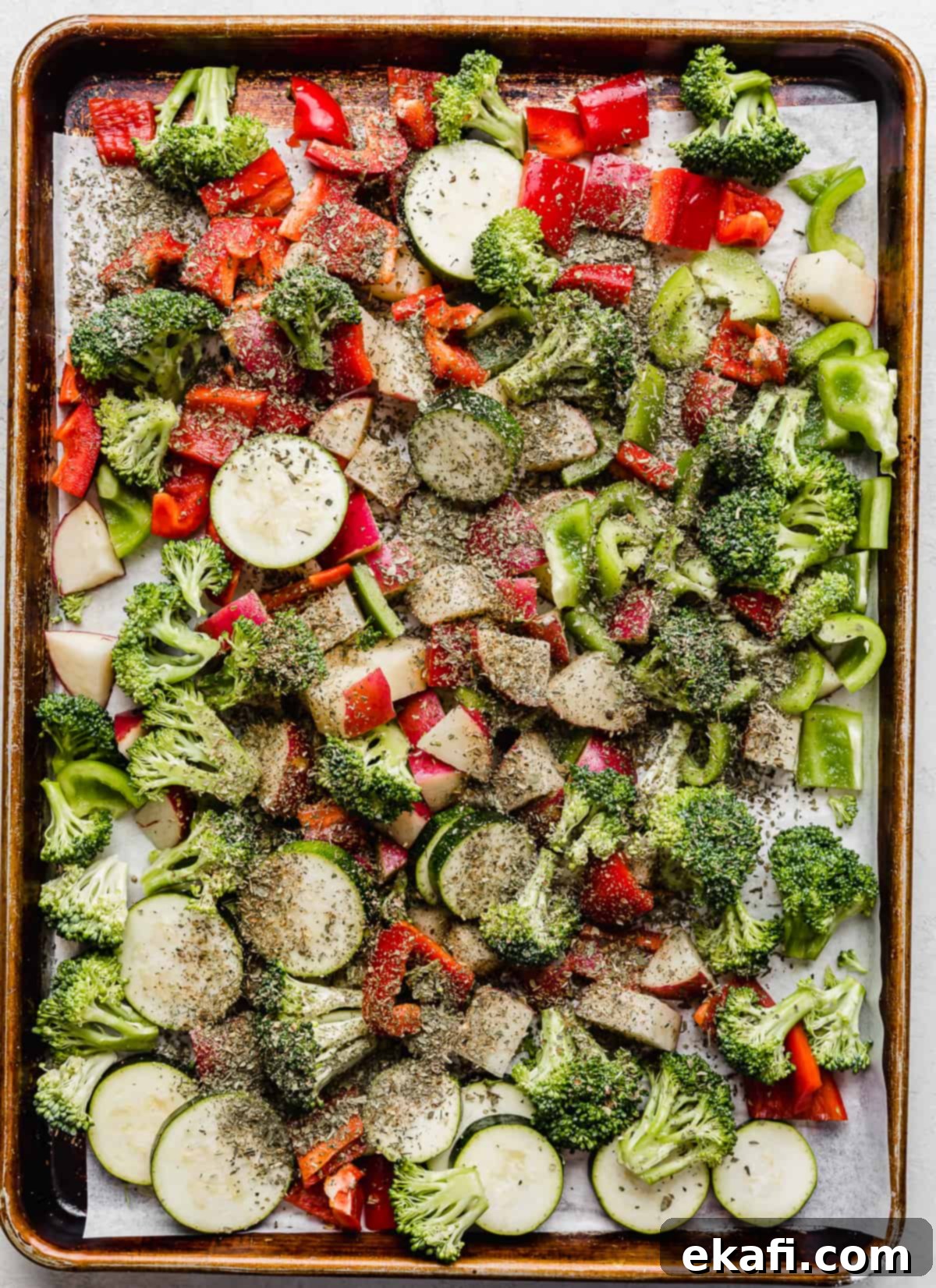 One Pan Roasted Italian Sausage and Vibrant Vegetables 7 A dried seasoning mixture poured overtop Sheet Pan Sausage and Veggies.