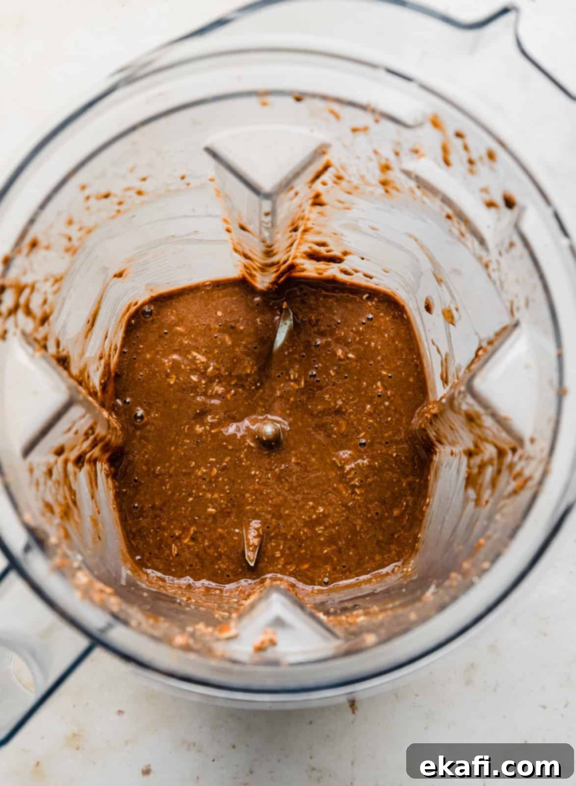 Chocolate Baked Oats Perfection 5 Blended Chocolate Baked Oats batter in a blender.
