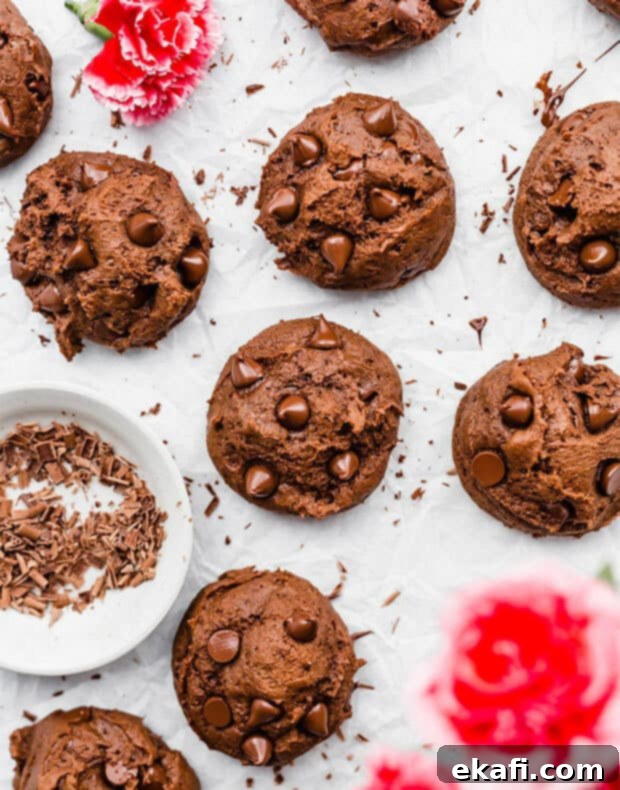 Decadent Double Chocolate Bites 13 An overhead photo of several rich, fudgy double chocolate chip cookies with melted chocolate chips.