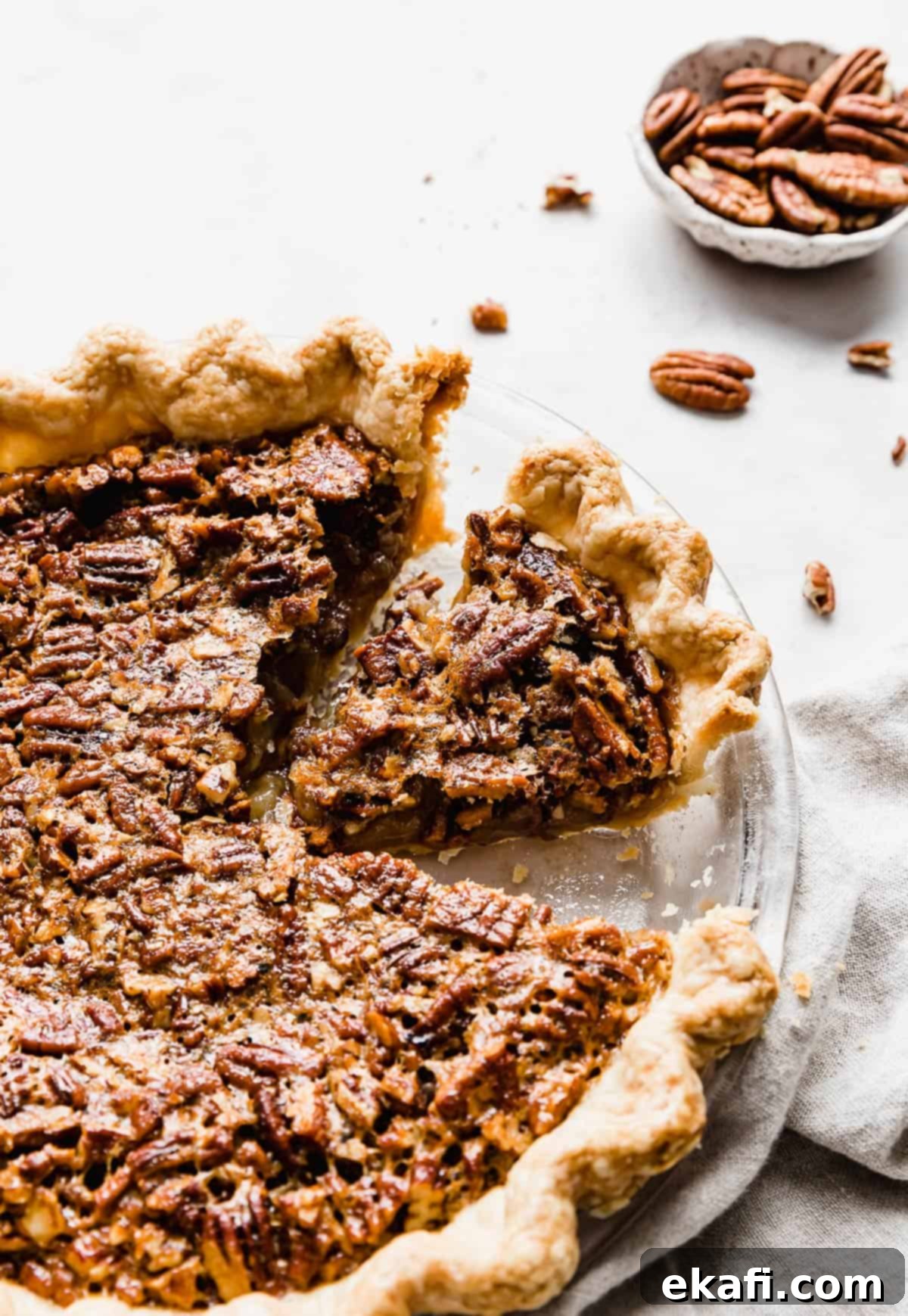 Sweet Southern Comfort: The Perfect Pecan Pie 2 A whole Southern Pecan Pie with a perfect golden crust, and a slice already cut, showcasing the rich, nutty topping and gooey filling.
