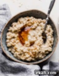 Golden Maple Brown Sugar Oats 8 A bowl of oatmeal on a white background.