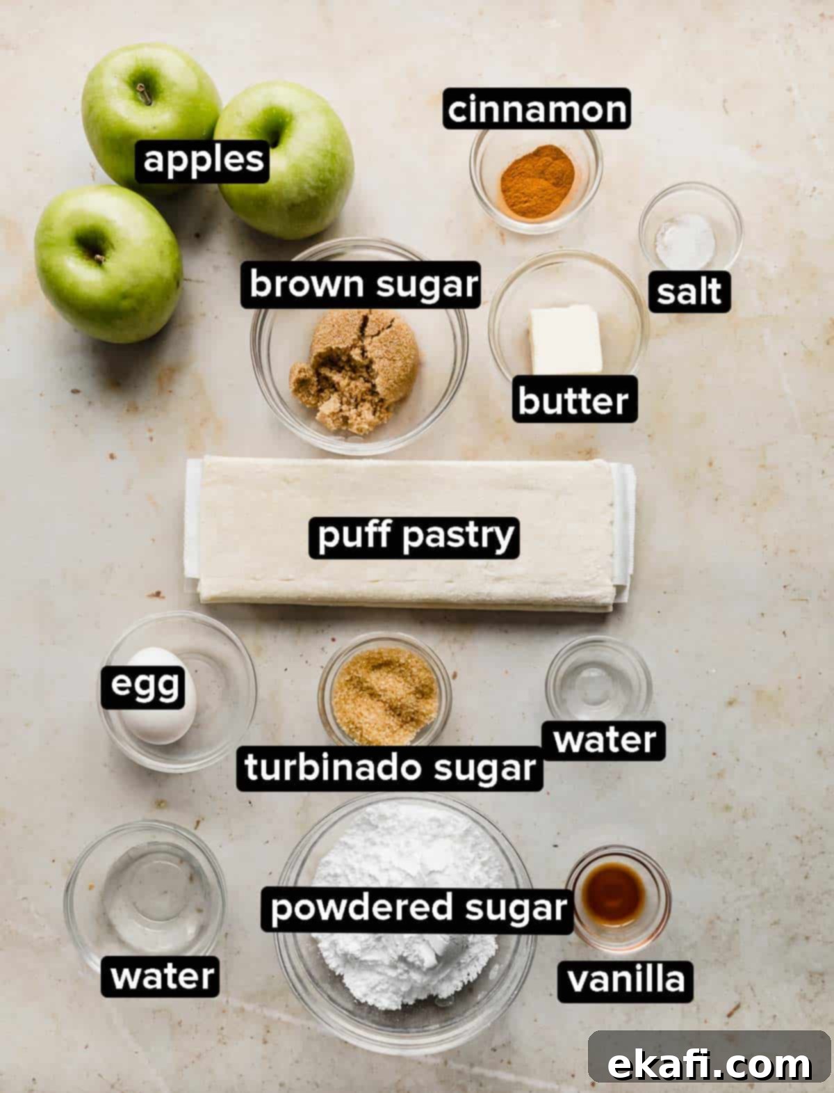 Flaky Apple Turnovers 3 Puff Pastry Apple Turnover ingredients laid out on a cream marbled background.
