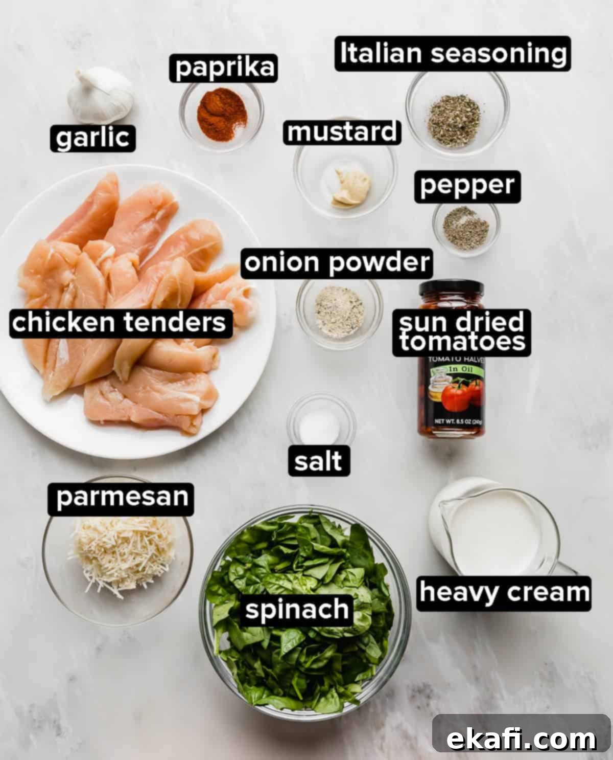 Tuscan Garlic Cream Chicken 3 Creamy Tuscan Chicken ingredients on a gray background.
