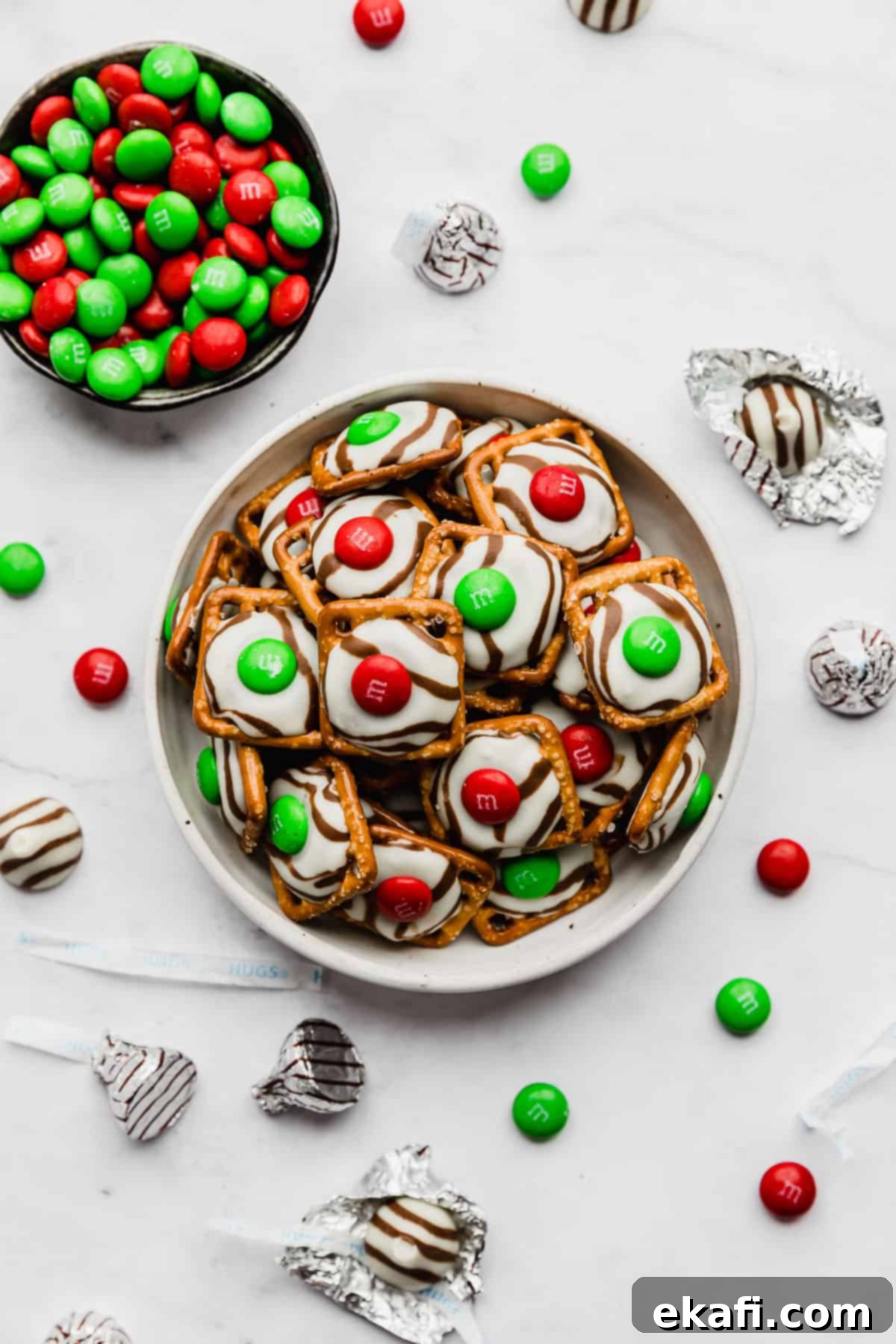 Christmas Pretzel Hugs 2 Christmas Pretzel Hugs in a white plate on a white background, showcasing their festive colors.