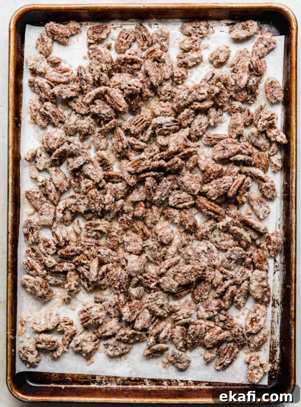Sweet Glazed Pecans 10 Baking sheet with cinnamon sugared pecans spread evenly, ready for the oven.