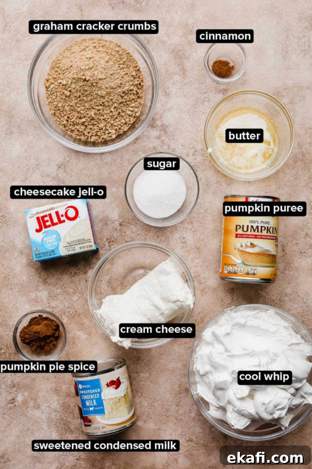 Quick Pumpkin Cheesecake Minis 3 No-bake pumpkin cheesecake ingredients on a brown background.