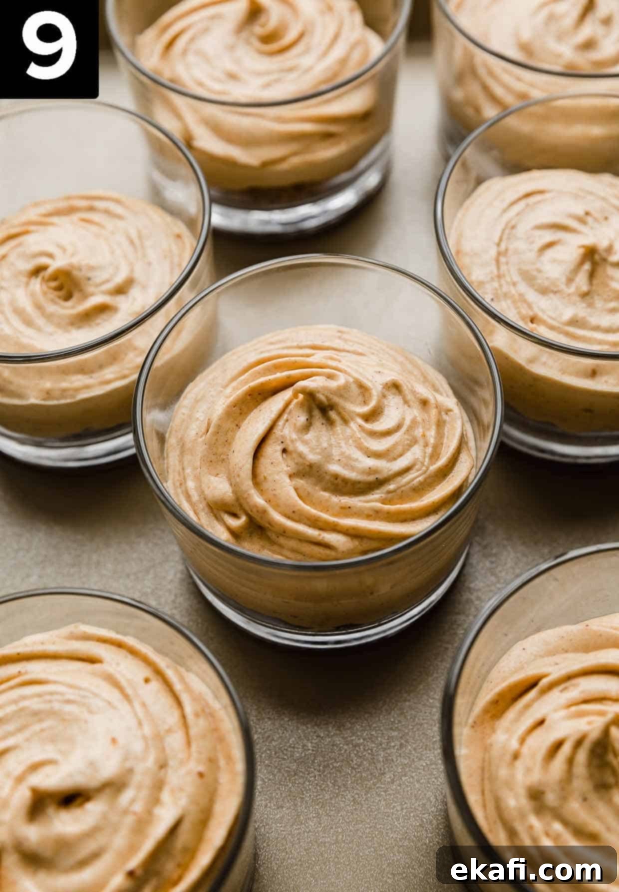 Quick Pumpkin Cheesecake Minis 6 Glass cups filled with graham cracker crust and a no-bake pumpkin cheesecake filling with cool whip.