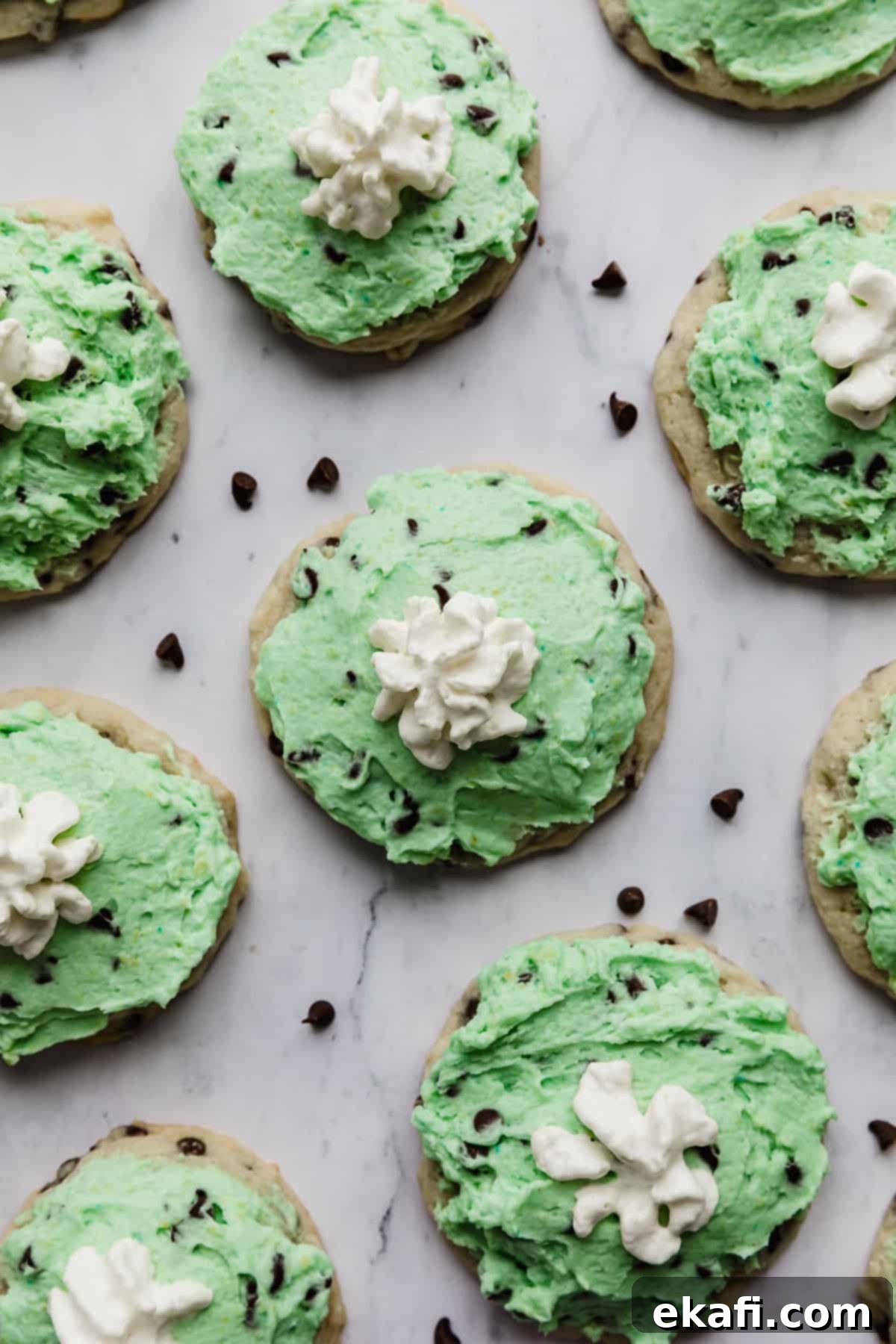 Crumbl's Mint Chip Ice Cream Cookie Delight 14 Crumbl Mint Chip Ice Cream Cookies on a white marble background.