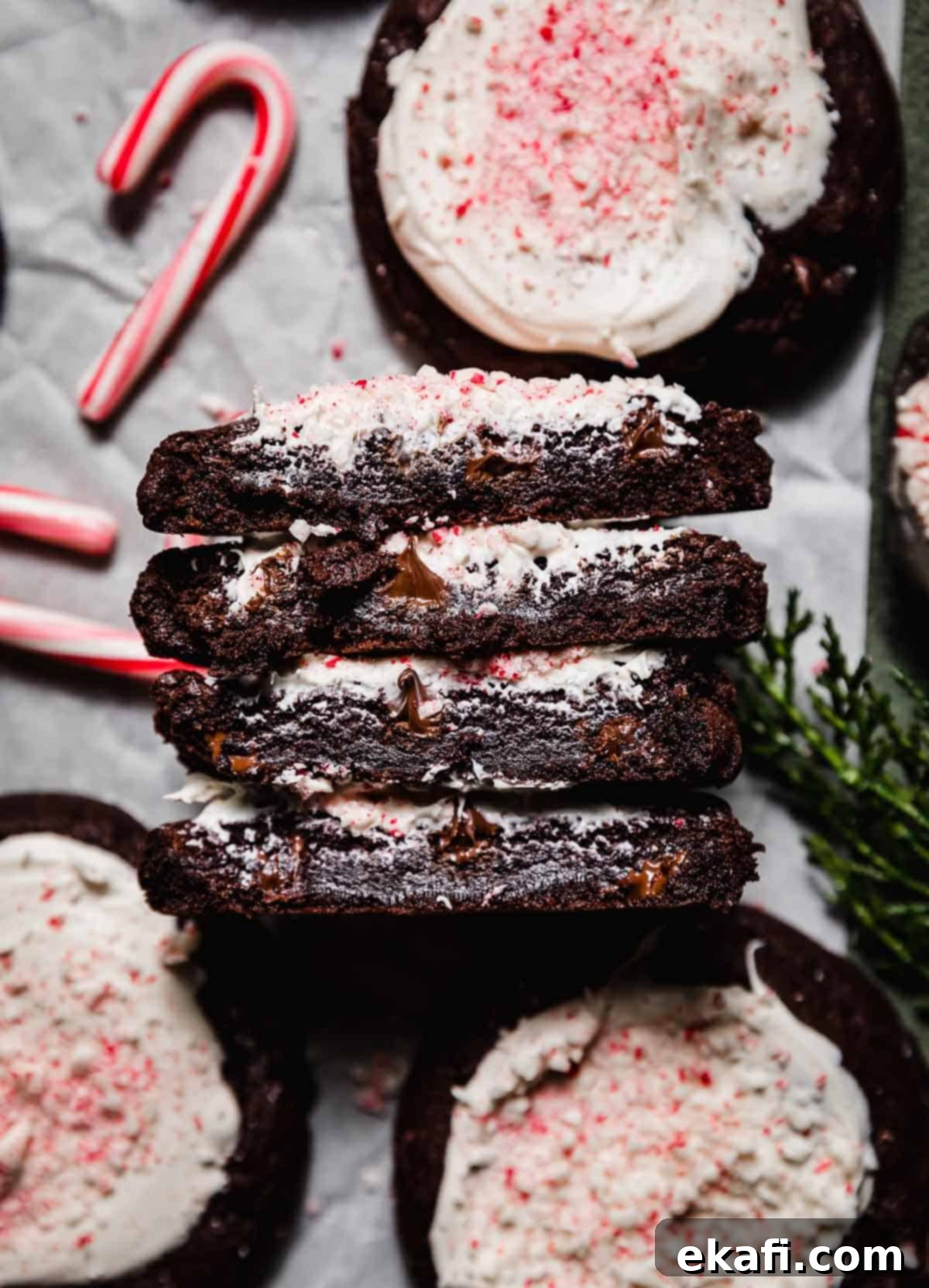 Chocolate Peppermint Bark Cookies 3 Two Peppermint Bark Cookies cut in half, showing the inside gooey centers.