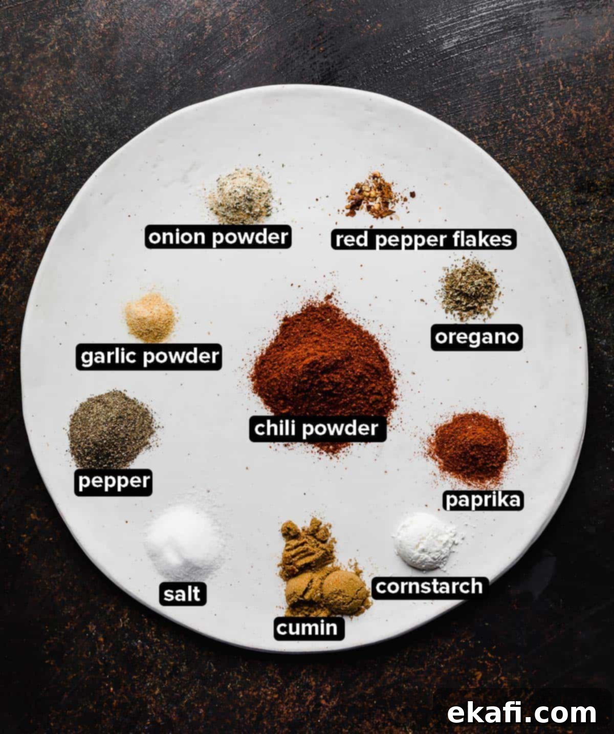 Mellow Fiesta Seasoning 3 Mild Taco Seasoning ingredients neatly arranged on a white plate, highlighting their fresh appearance.