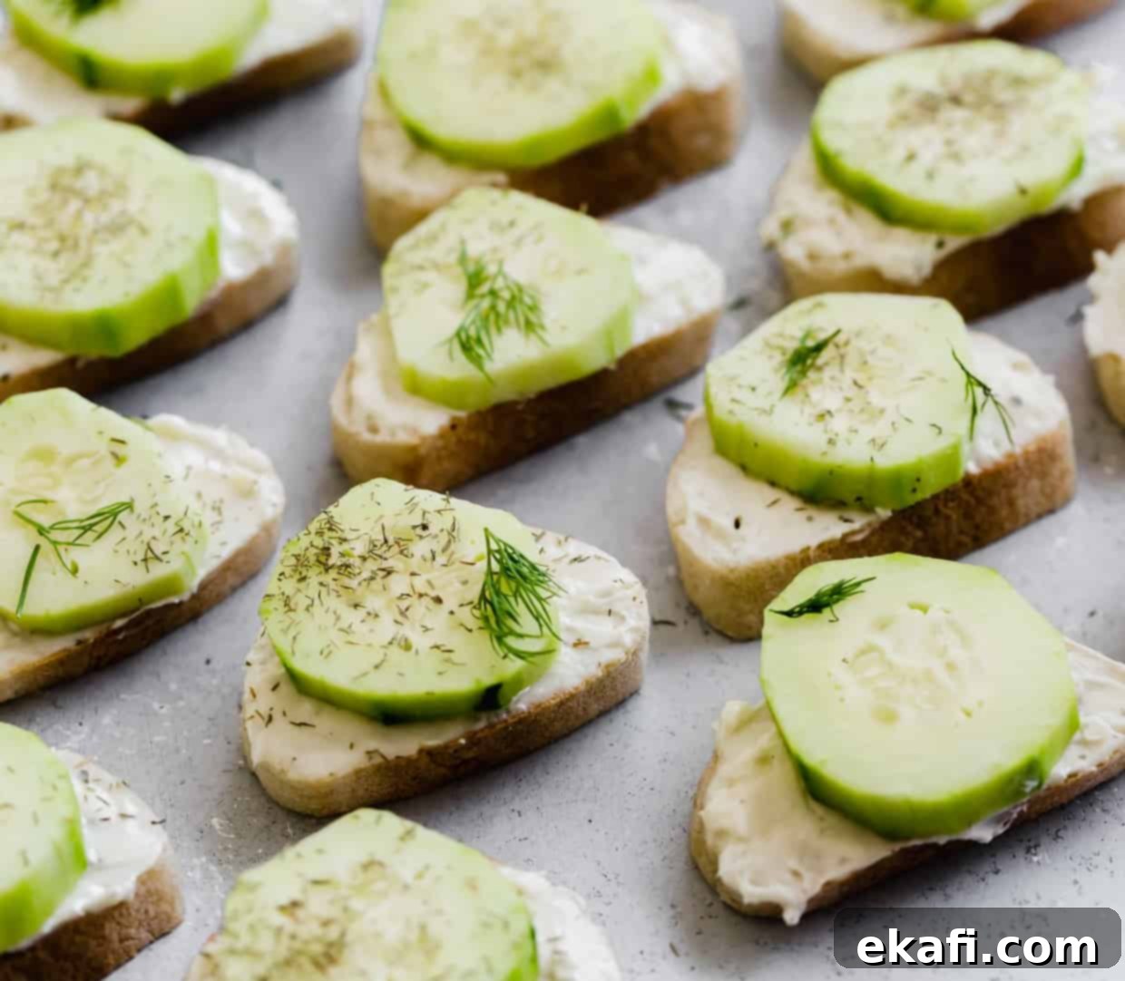 Cool Cucumber Cream Cheese Poppers 2 Sliced baguettes layered with a cream cheese spread and sliced cucumber.
