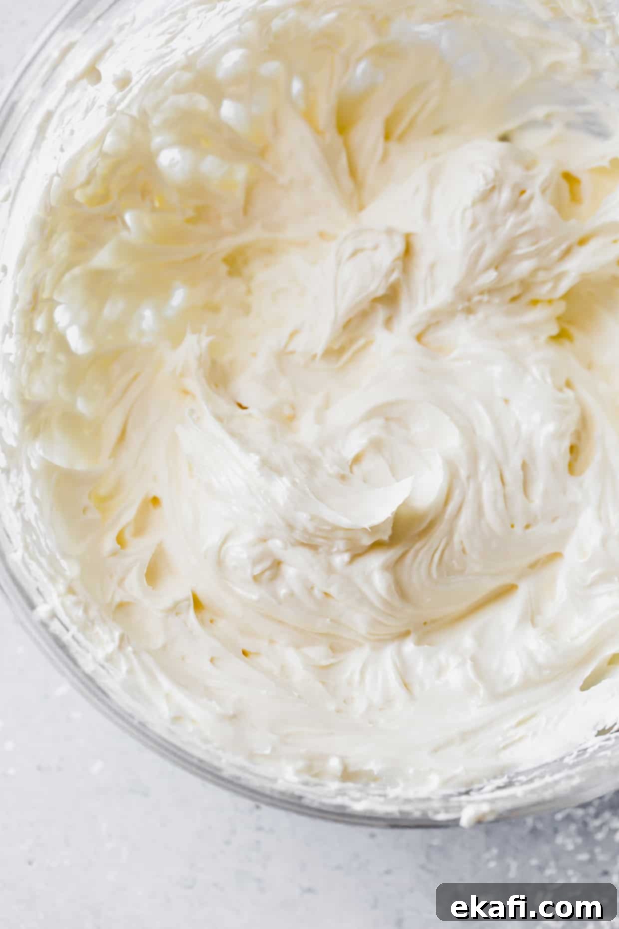 Cool Cucumber Cream Cheese Poppers 4 Cream cheese and mayonnaise whipped in a glass bowl.