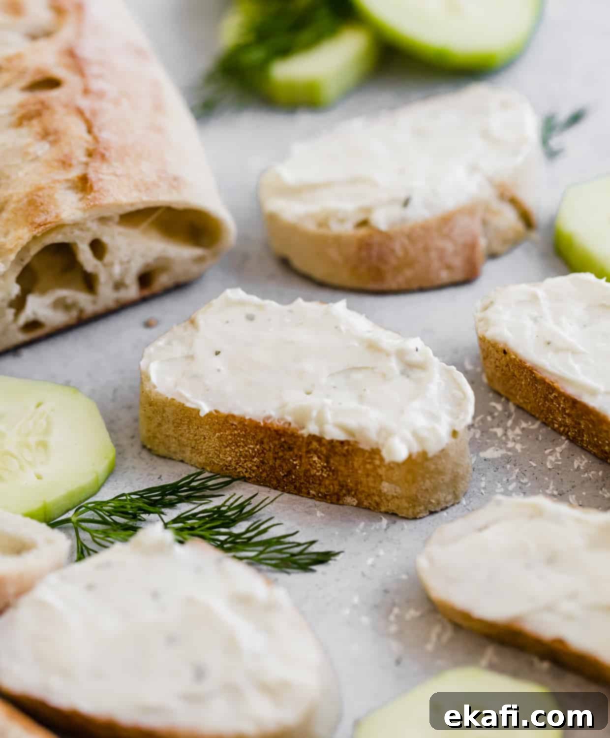 Cool Cucumber Cream Cheese Poppers 6 Sliced baguette with cream cheese mixture spread over the sliced bread.