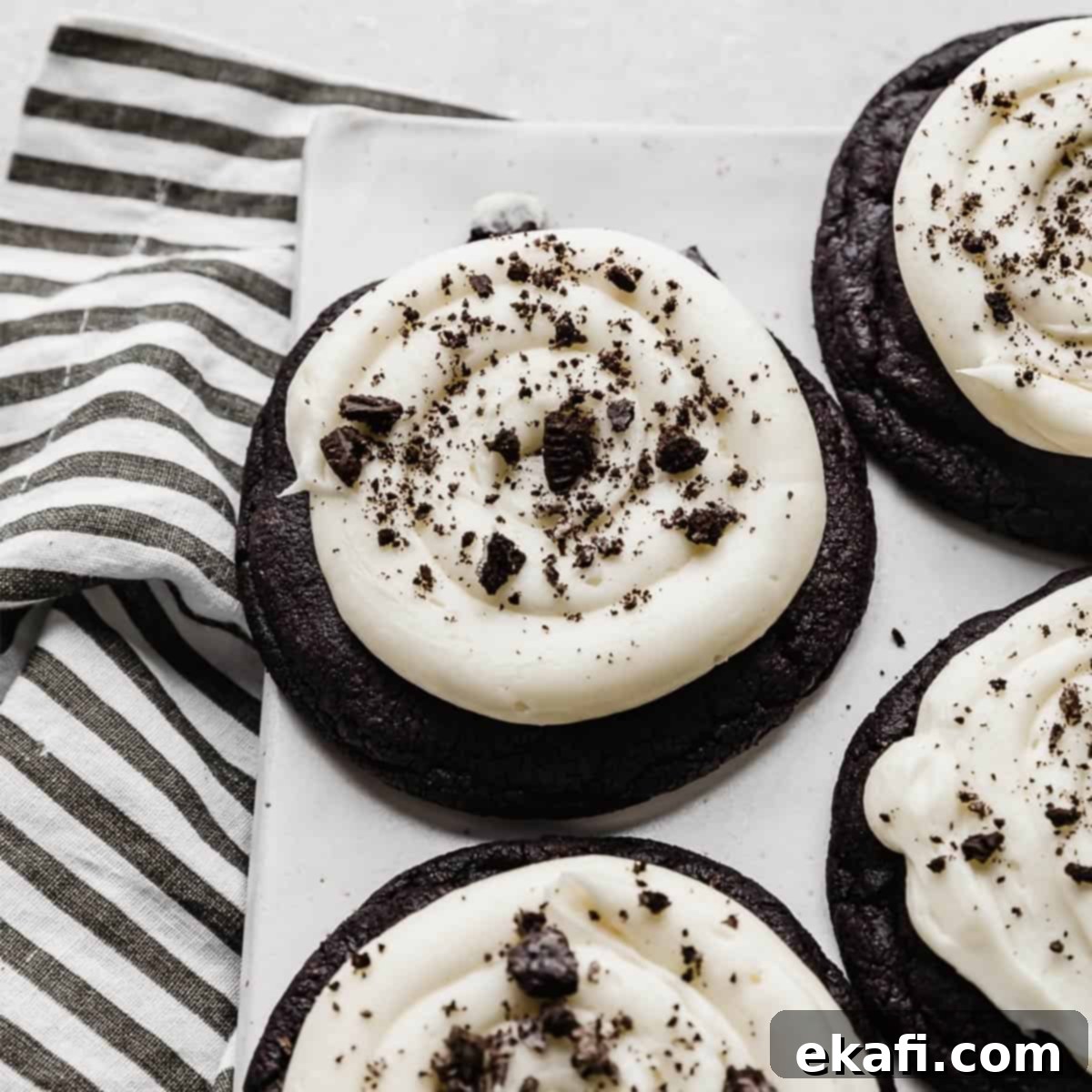Deep & Dark Black Cocoa Delights 7 A Chocolate Oreo Crumbl Cookie on a white plate.