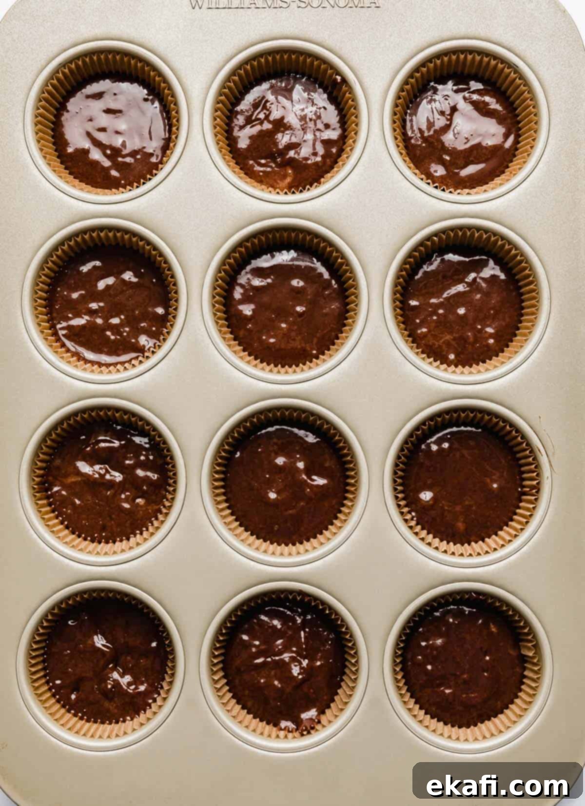 Decadent Ferrero Rocher Cupcakes 5 Chocolate hazelnut batter in cupcake lined muffin tin.