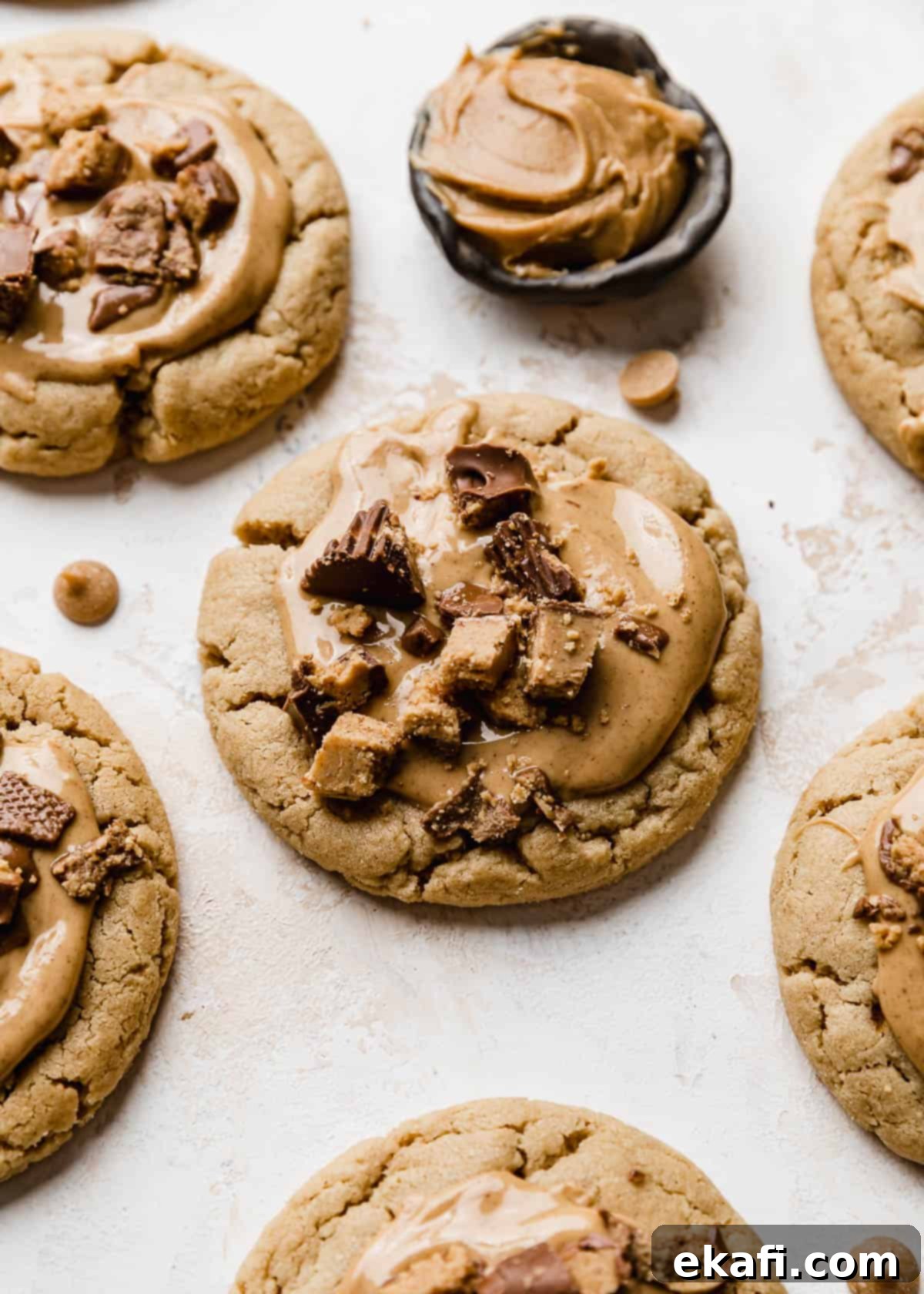 Decadent Peanut Butter Cup Cookies 2 A Crumbl Peanut Butter Cup Cookie topped with melted peanut butter and topped with chopped Reese's cups.
