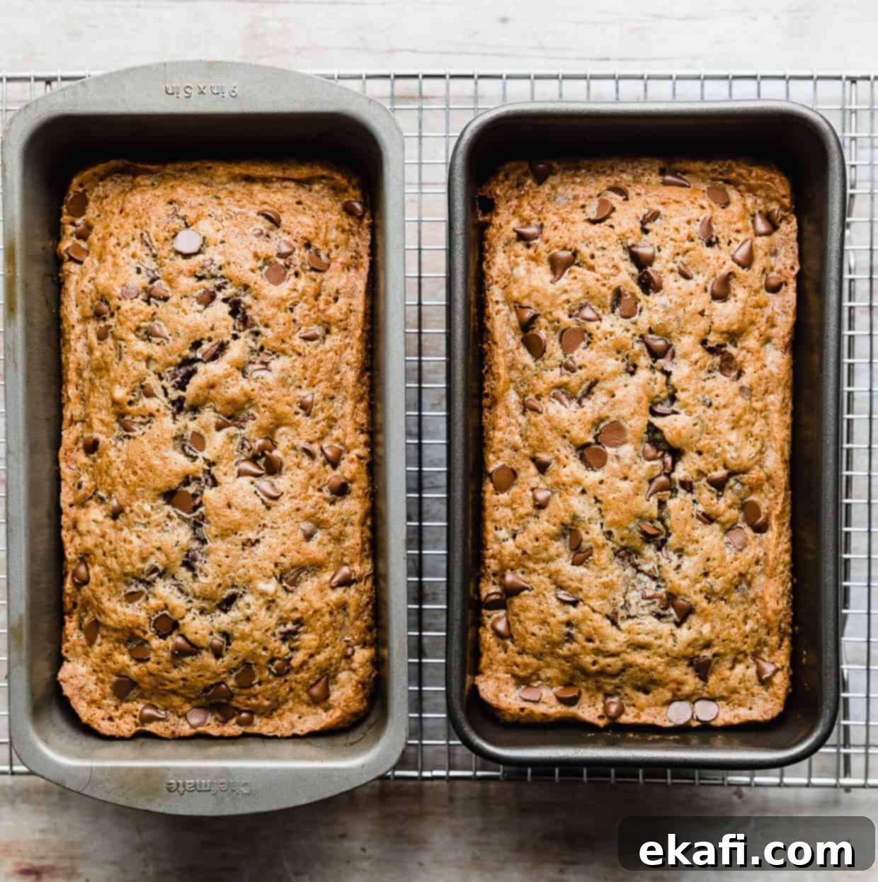 Decadent Chocolate Chip Zucchini Loaf 11 Two beautifully baked, golden brown Chocolate Chip Zucchini Breads cooling in their pans, side by side.