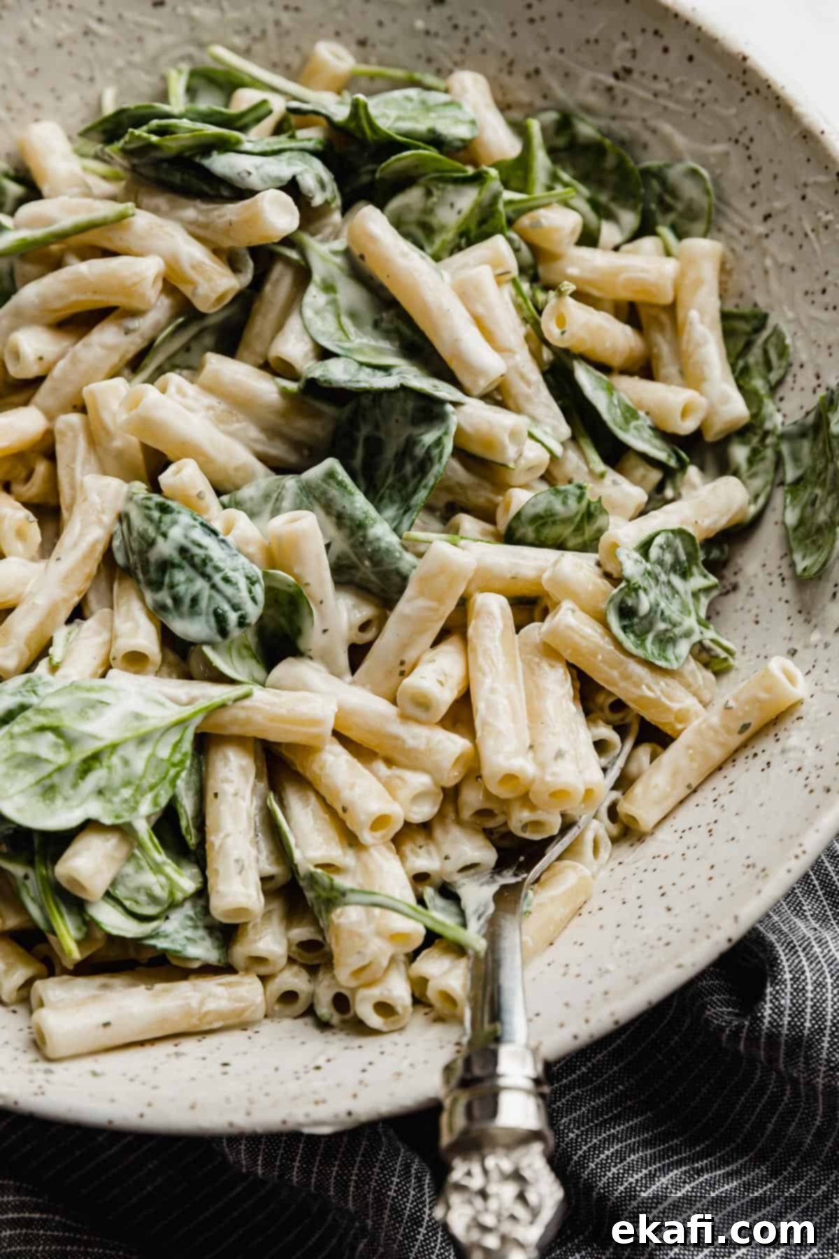 Creamy Boursin Pasta 6 Creamy Boursin cheese pasta with spinach in a serving bowl.