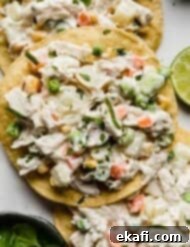 Mexican Chicken Salad 6 Mexican chicken salad on a tostada with cilantro for garnish.