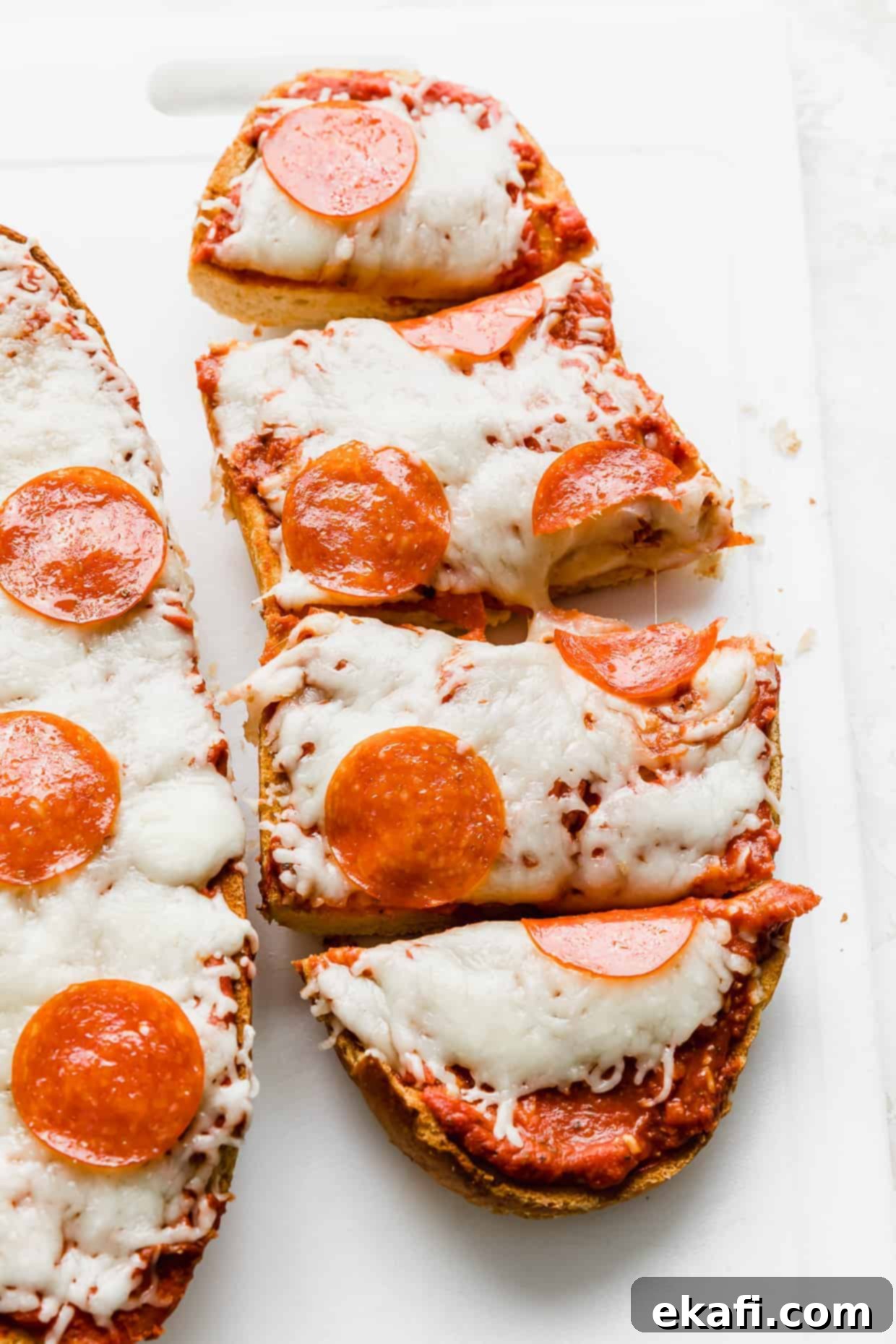 French Bread Pizza 11 A pepperoni French bread pizza on a white background.