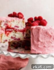 Perfect Lemon Raspberry Cake 15 A slice of a two layer Lemon Raspberry Cake.
