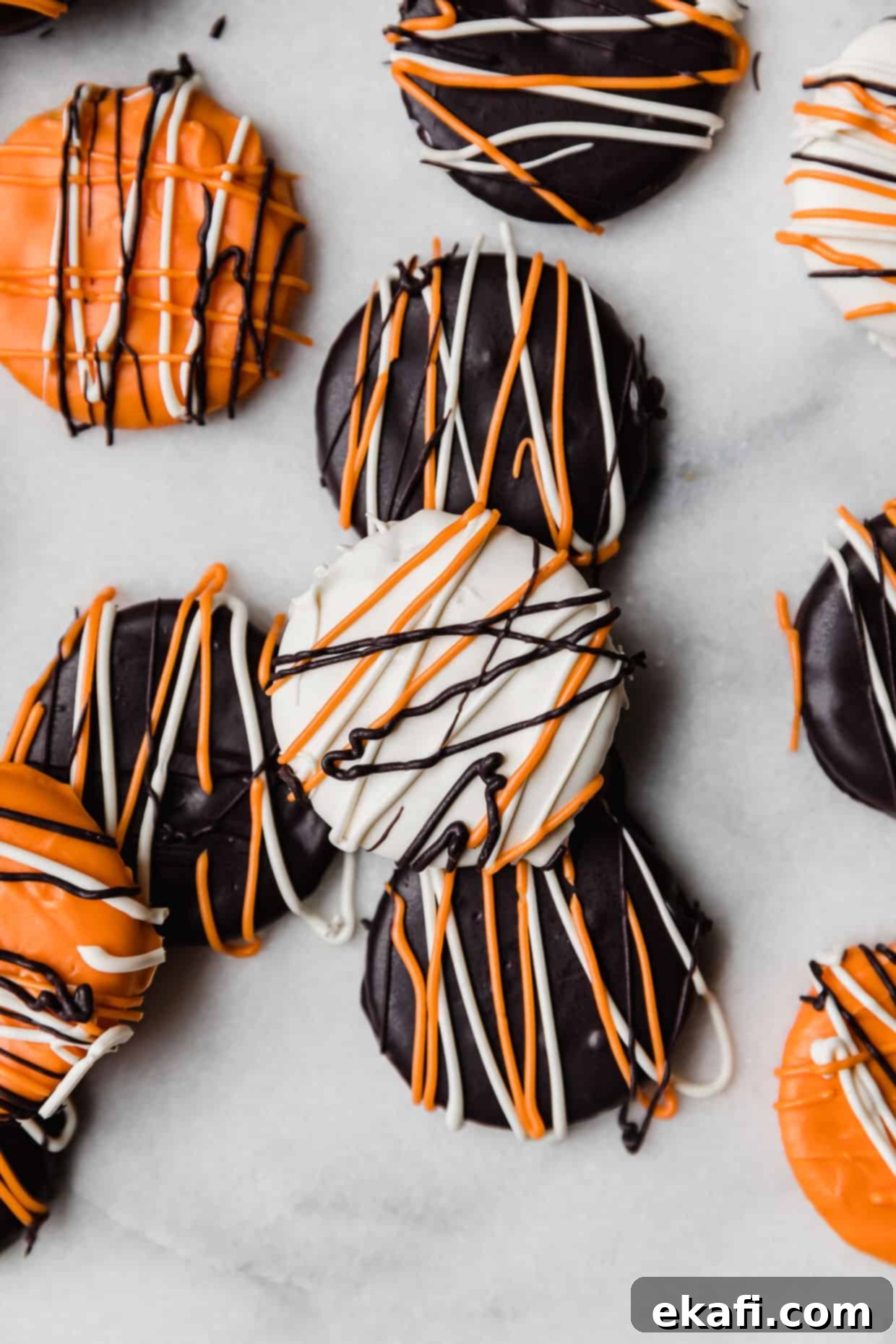 Haunted Snaps 2 Ritz crackers covered in black, orange, and white chocolate, arranged festively for Halloween.