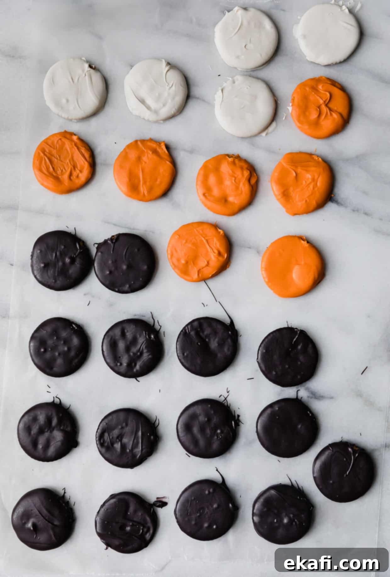 Haunted Snaps 7 A tray of orange, white, and black covered Halloween Crackers with various decorations.