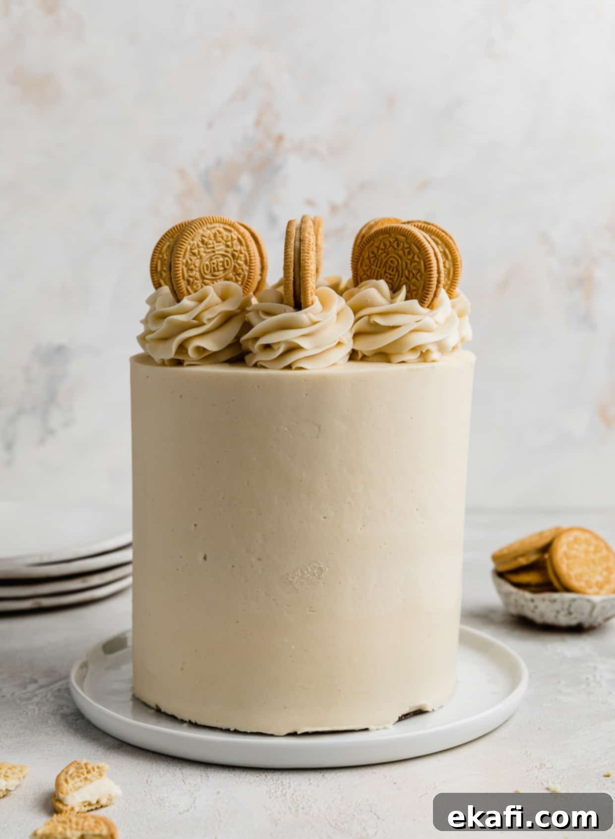 Golden Oreo Dream Cake 12 A Golden Oreo Cake topped with frosting swirls and Golden Oreos.