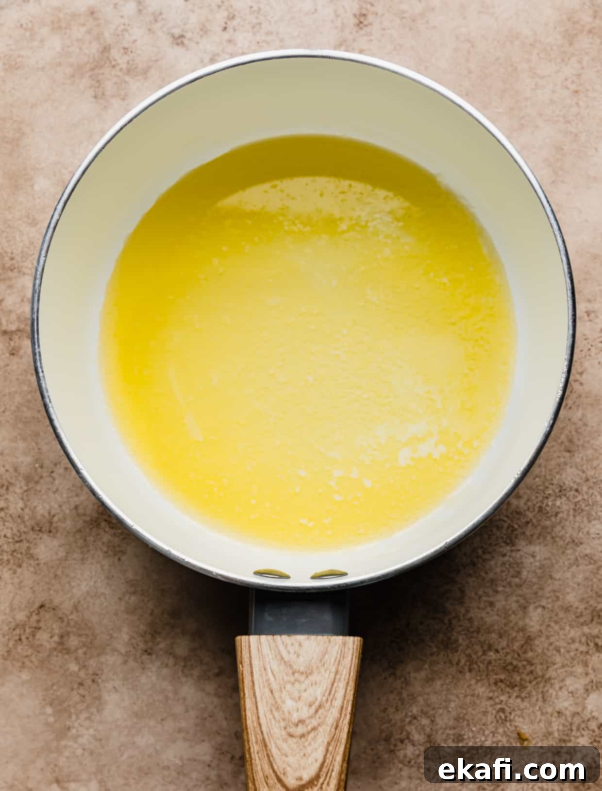 Salted Butterscotch Sauce 4 A white saucepan with melted butter in it, ready for the next ingredients.