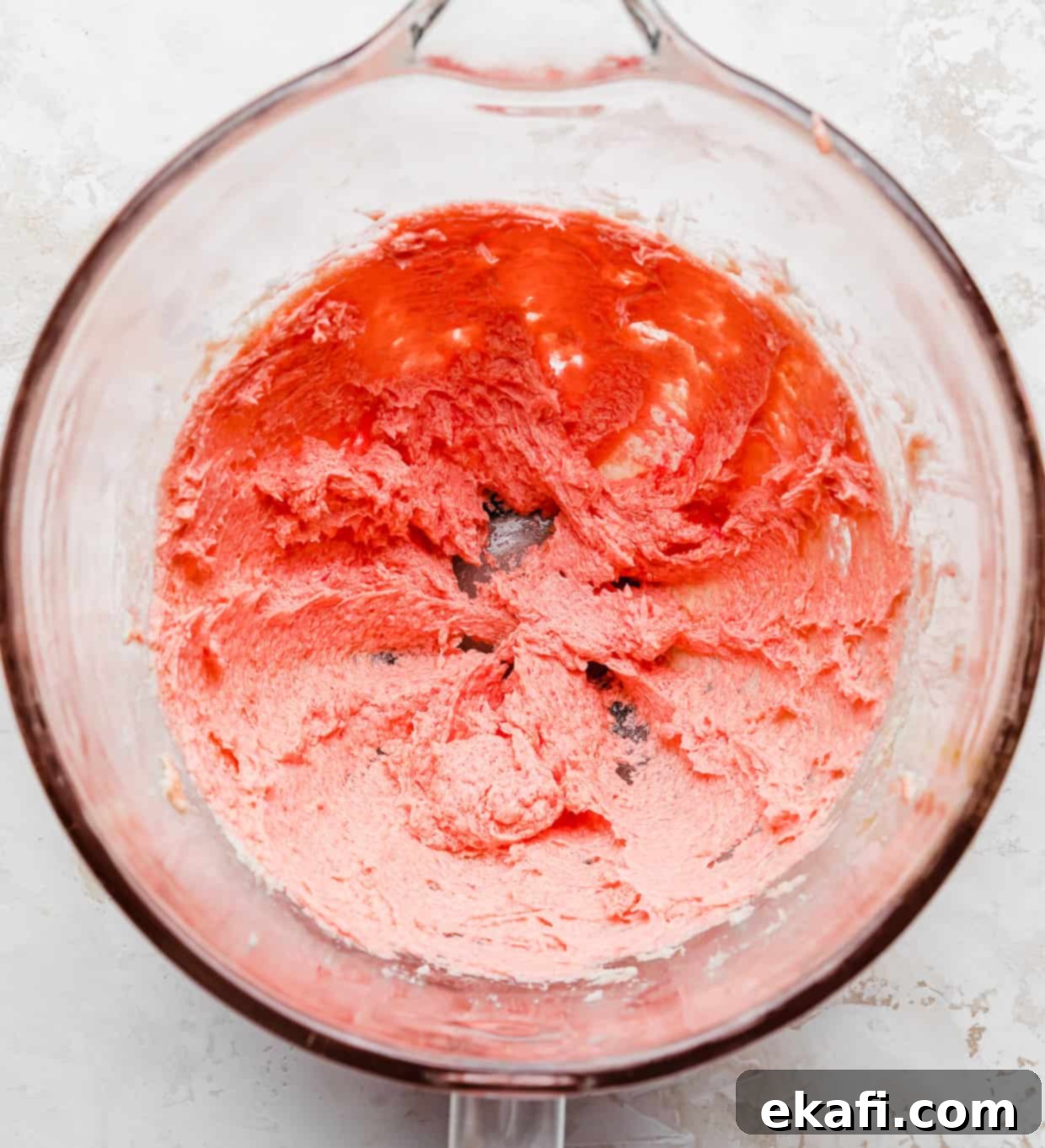 Blush Velvet Crumbl Delights 4 Pink Velvet Cookie batter in a glass bowl.