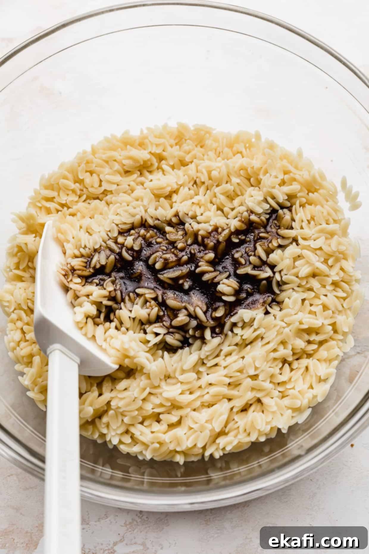 Perfect Summer Caprese Orzo 5 A Caprese Orzo Salad dressing made from balsamic vinegar overtop of the orzo pasta.