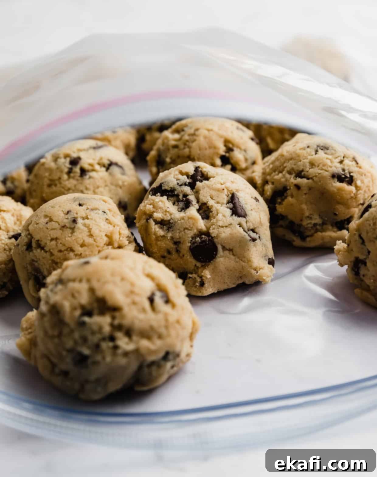 Freeze Cookie Dough for Instant Treats 8 How to freeze cookie dough balls: chocolate chip cookie dough balls in a ziplock bag.