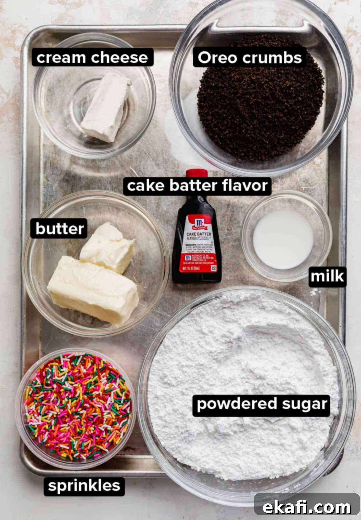 Crumbl Oreo Birthday Cake Cookie Delight 4 Ingredients used to top the Crumbl Oreo Birthday Cake Cookies: sprinkles, powdered sugar, butter, milk, cake batter extract, oreo crumbs, and cream cheese.