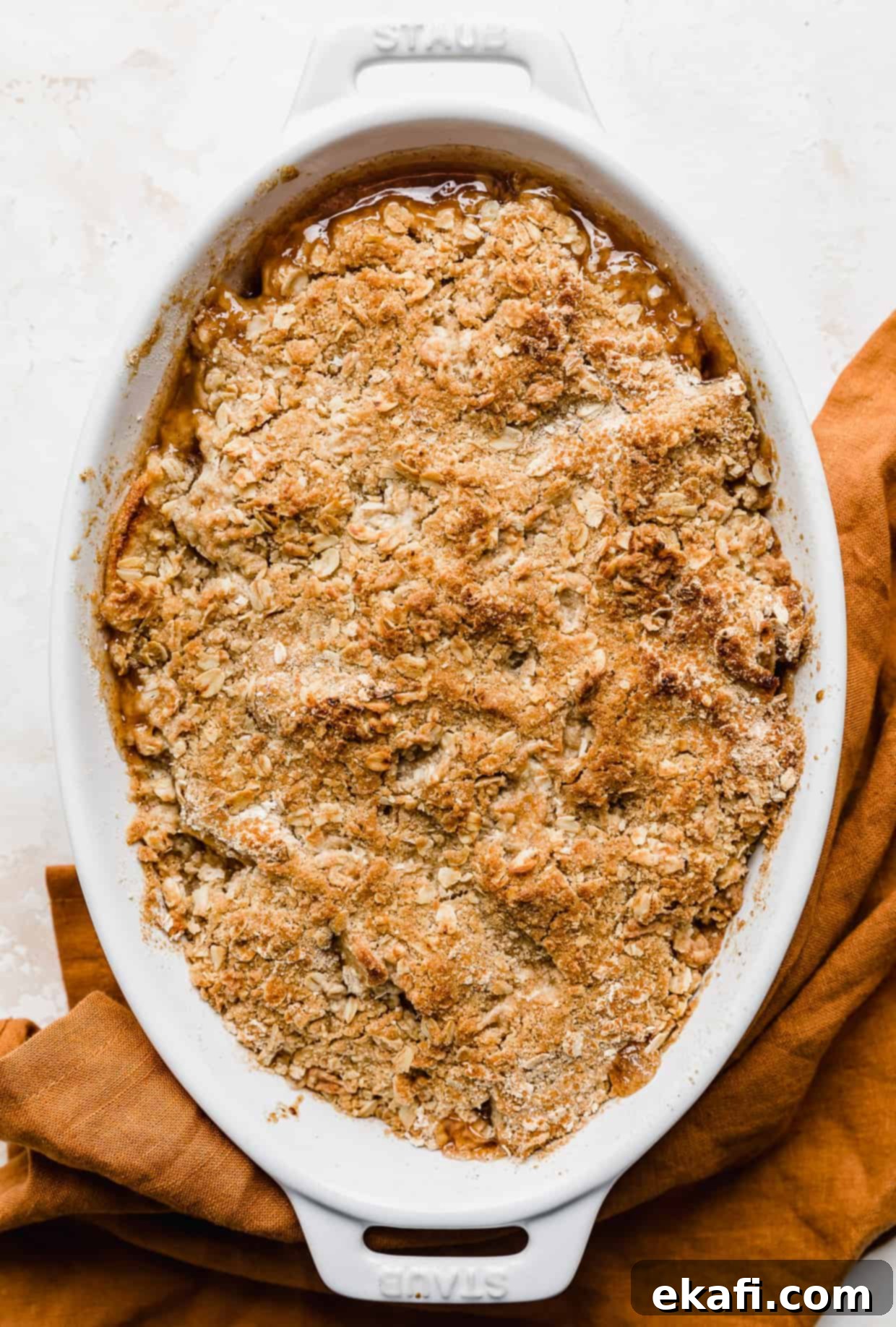 Quick & Easy Apple Crisp 13 A golden brown baked Easy Apple Crisp Recipe on a white background.