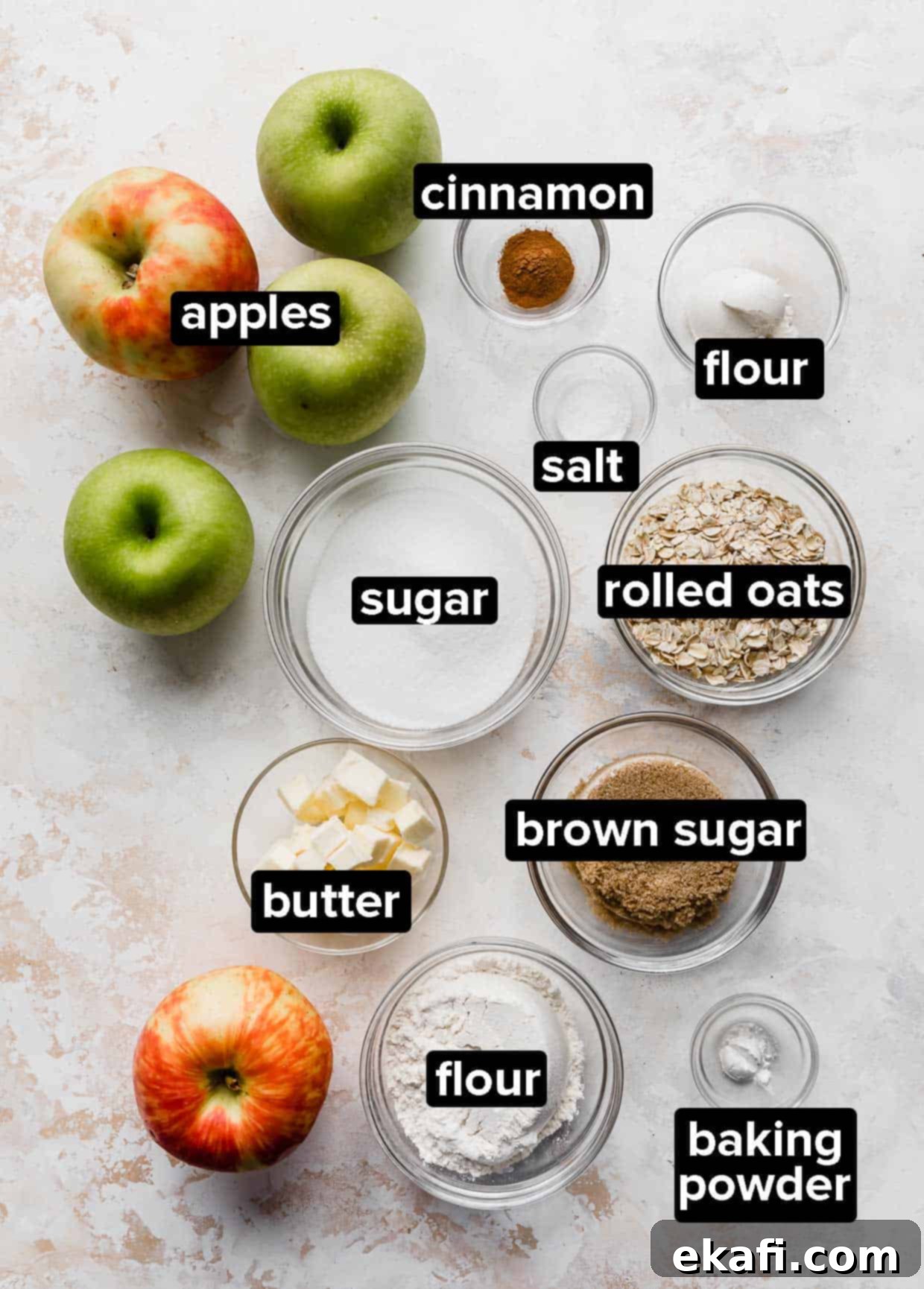 Quick & Easy Apple Crisp 3 Easy Apple Crisp ingredients on a textured white background.