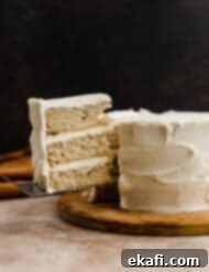 Toasted Butter Bliss 11 A three layered Brown Butter Cake with a slice of cake cut and balancing on a knife.