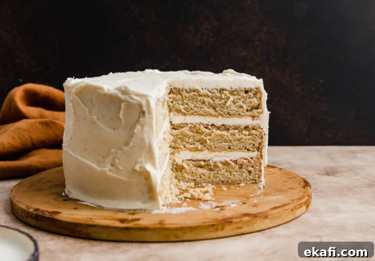 Toasted Butter Bliss 7 A three layered brown butter cake recipe with a slice removed from the cake.