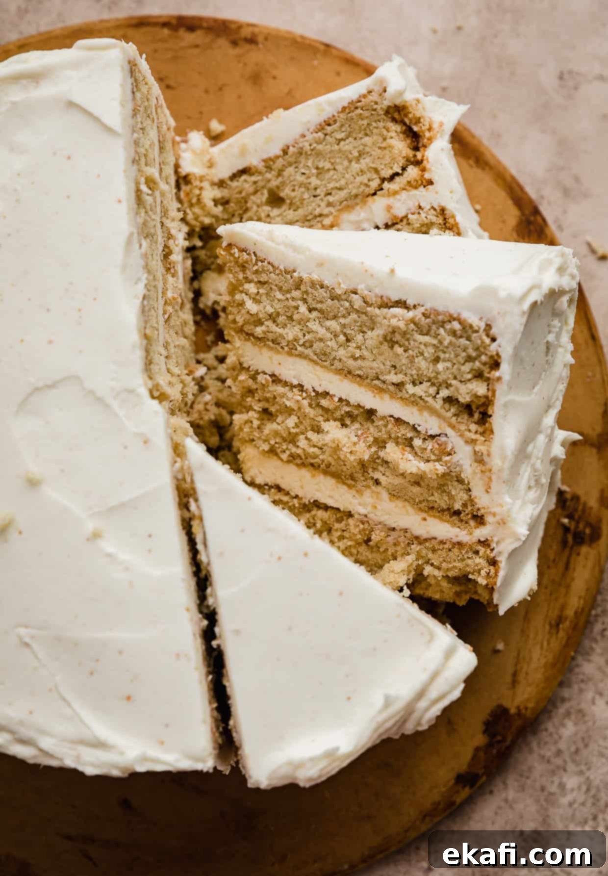 Toasted Butter Bliss 8 Slices of Brown Butter Cake topped with brown butter frosting on a brown background.